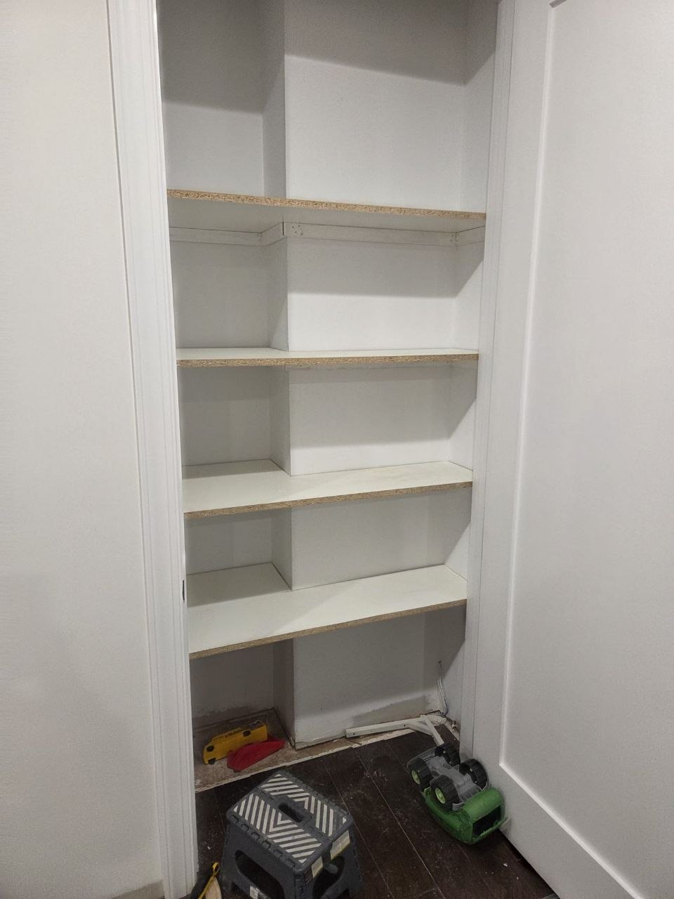 Same closet with painted shelves installed.