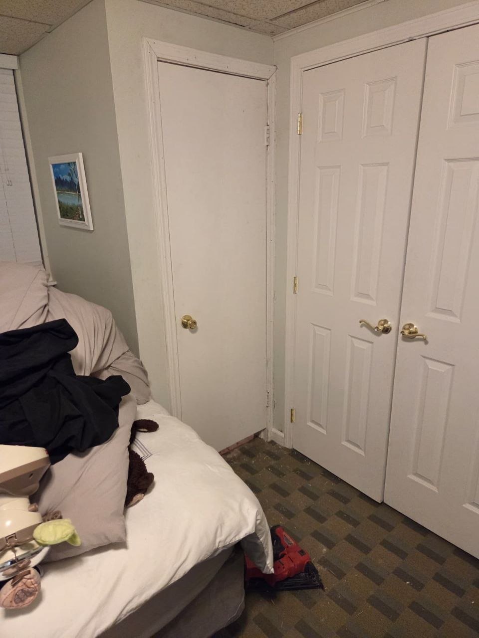 Same closet with a door hung and hardware on.