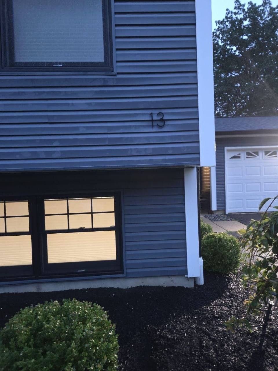 Same corner with black house number 13 installed.